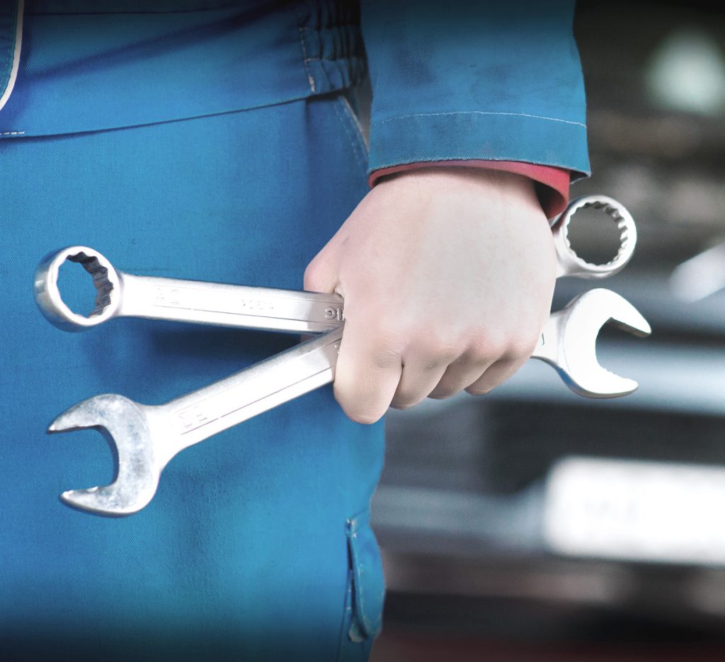 Mechanic holding a spanner - Vehicle Insurance Repairs